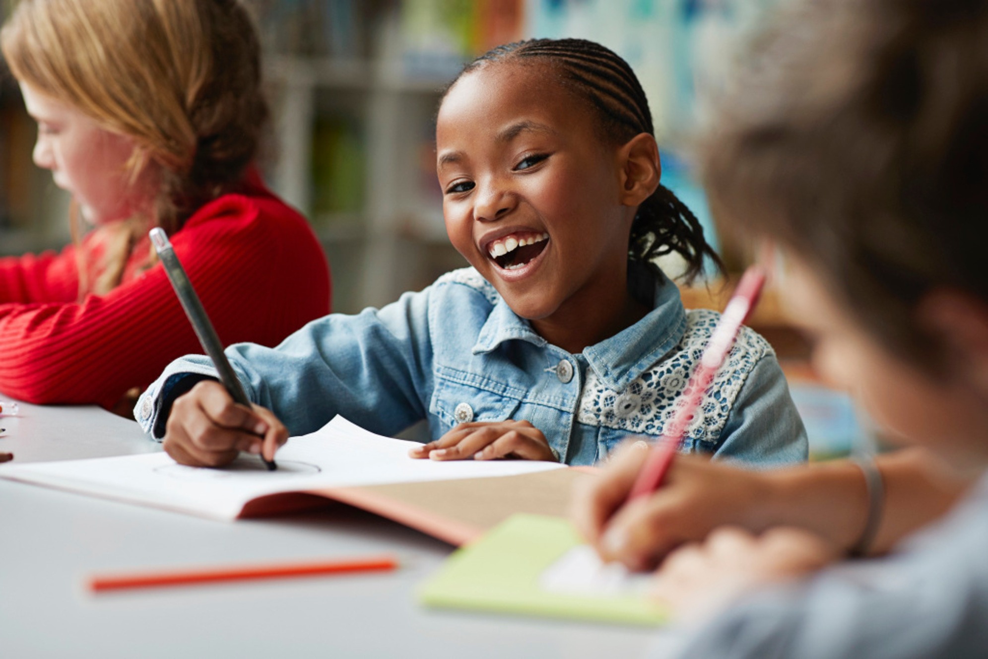 A confident student smiling in her school library